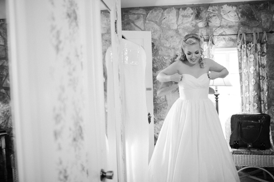 bride putting dress on