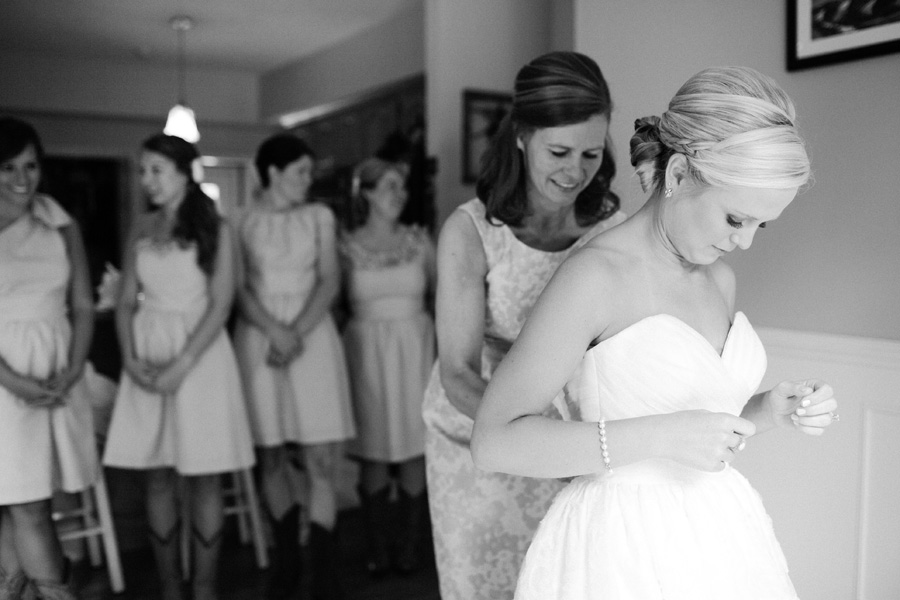 bride putting dress on
