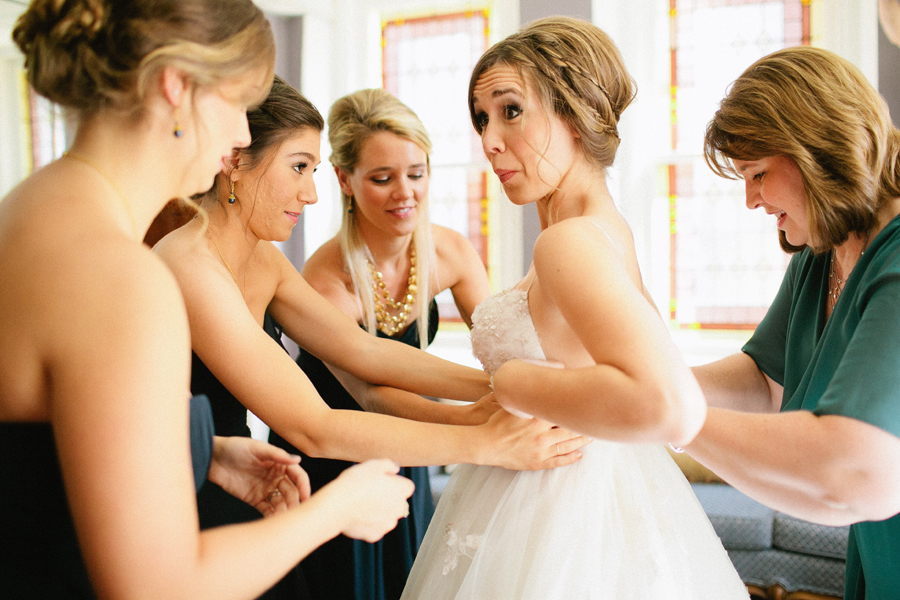 bride putting dress on
